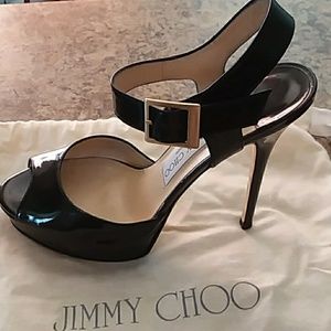 Jimmy Choo opened toe strappy heels.